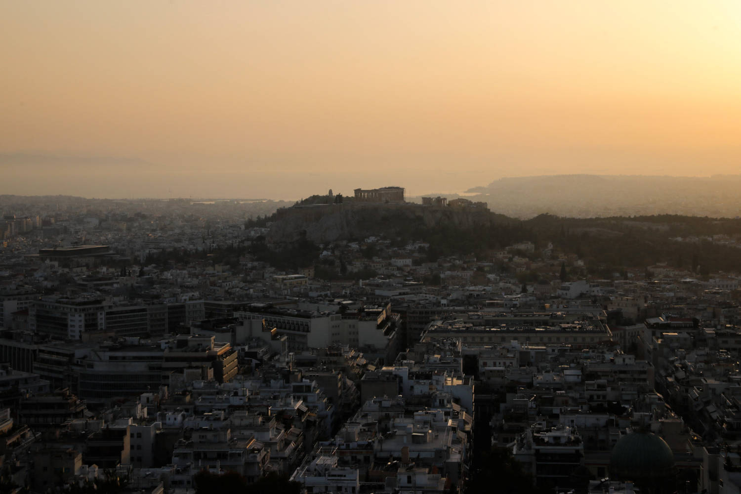 The Parthenon Temple Is Seen Atop The Acropolis, In Athens