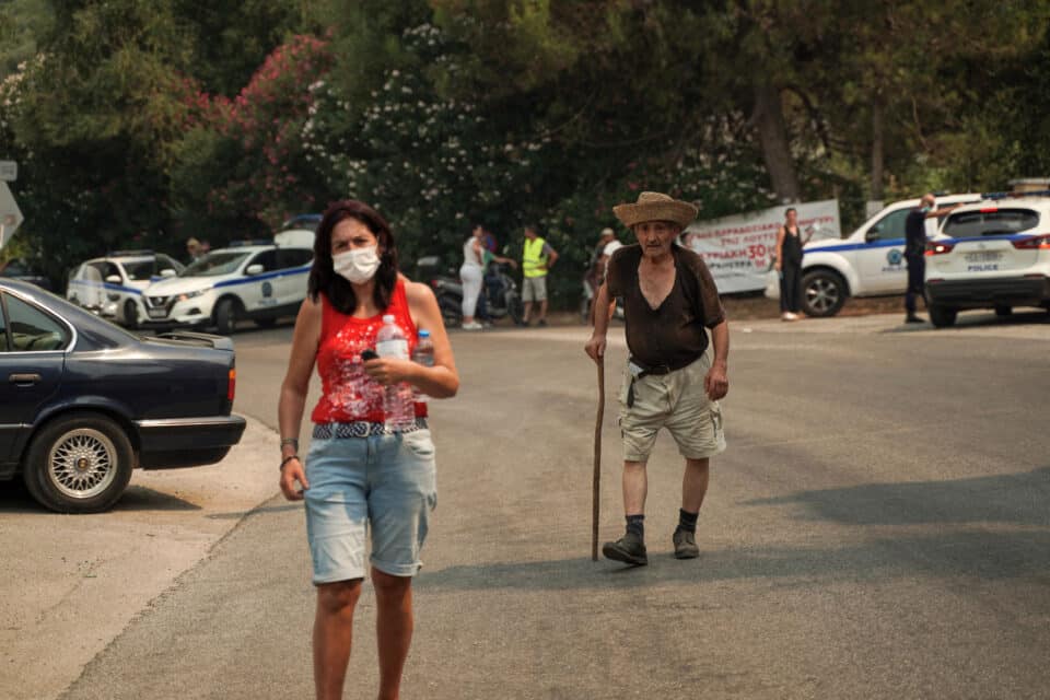 People leaving the village of Loutses, on the island of Corfu, Greece, July 25, 2023. REUTERS/Adonis Skordilis