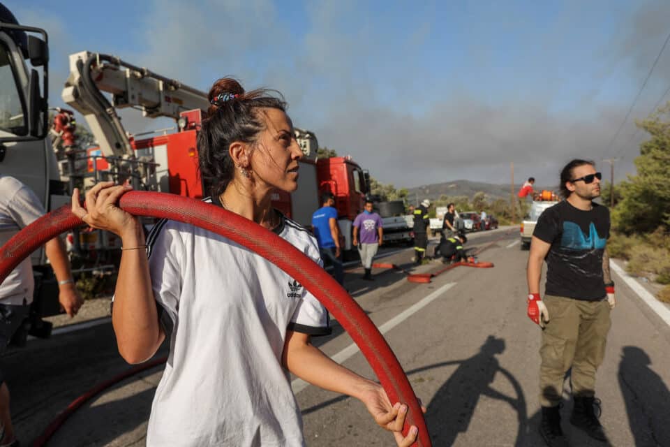 A volunteein the village of Vati, on the island of Rhodes, Greece, July 26, 2023. REUTERS/Nicolas Economou