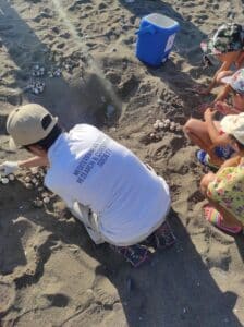 biologist angela mastrogiacomo with some young helpers