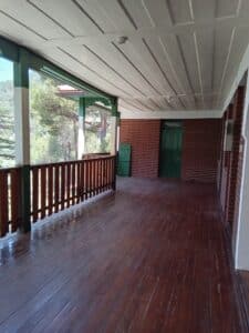 feature nick upstairs veranda of the rooms for rent at stavros tis psokas