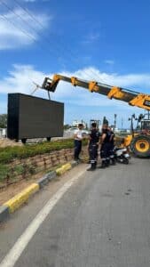 billboard under crane