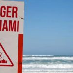 Japan revises magnitude of earthquake to 7.7 as tsunami threat looms