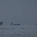 Iran warns ships to stay clear of Hormuz as Trump calls crisis meeting