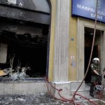 Greece arrests two over deadly 2010 protest fire-bombing